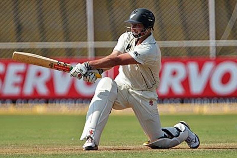 Jesse Ryder hits out to leg on his way to a Test century against India in Ahmedabad.