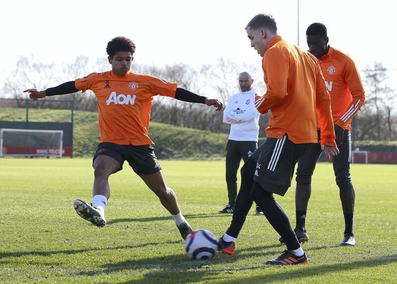 MANCHESTER, ENGLAND - FEBRUARY 26: (EXCLUSIVE COVERAGE) Shola Shoretire and Donny van de Beek of Manchester United in action during a first team training session at Aon Training Complex on February 26, 2021 in Manchester, England. (Photo by Matthew Peters/Manchester United via Getty Images)