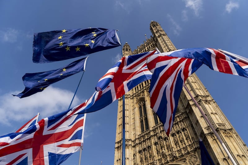 (FILES) In this file photo taken on March 28, 2019 Union and EU fags flutter outside the Houses of Parliament in Westminster, London. British Prime Minister Boris Johnson announced on August 28, 2019 that the suspension of parliament would be extended until October 14 -- just two weeks before the UK is set to leave the EU -- enraging anti-Brexit MPs. / AFP / Niklas HALLE'N
