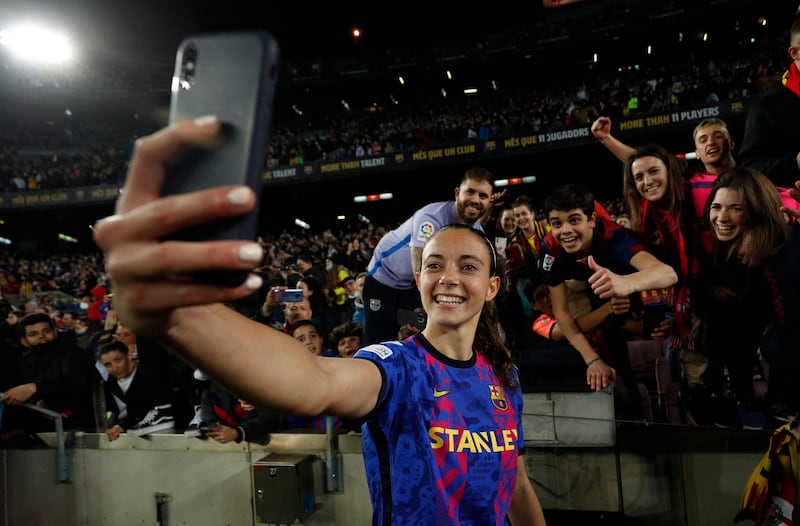 Barcelona's Aitana Bonmati takes a selfie with fans. Reuters
