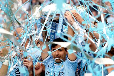 (FILE) - Manchester City's Sergio Aguero lifts the English Premier League trophy after  winning the English Premier League soccer match between Manchester City and West Ham United in Manchester, Britain, 11 May 2014 (re-issued on 15 December 2021).  Argentinian striker Sergio 'Kun' Aguero announced his retirement during a press conference in Barcelona, Spain, on 15 December 2021.   EPA / ANDY RAIN