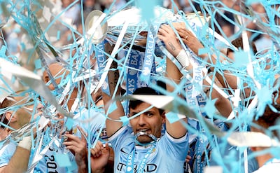 Manchester City's Sergio Aguero lifts the Premier League trophy in 2014. EPA