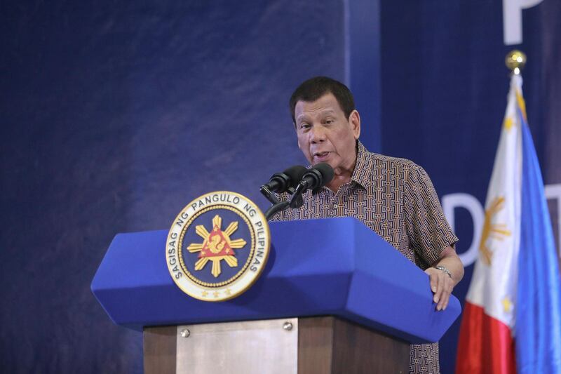 epa08157555 A handout photo made available by the Presidential Photographers Division (PPD) shows Philippine President Rodrigo Duterte delivering a speech at the San Isidro Central School, during the distribution of benefits to former rebels in Leyte province, Philippines, 23 January 2020 (issued 24 January 2020).  EPA/VALERIE ESCALERA / PPD /HANDOUT  HANDOUT EDITORIAL USE ONLY/NO SALES