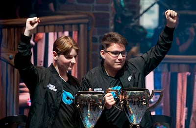 Emil "Nyhrox" Bergquist Pedersen (L) and Thomas "Aqua" Arnould pose with their trophies after winning the Duos competition during the 2019 Fortnite World Cup on July 27, 2019 inside of Arthur Ashe Stadium, in New York City.  / AFP / Johannes EISELE
