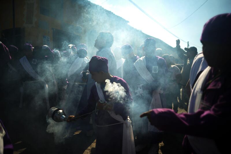 Members of the Brotherhood of El Nazareno participate in the 'Jesus of Nazareth' procession in the indigenous town of Izalco, 60 km west of San Salvador on March 28, 2013, one day before Good Friday. Christians around the world mark the holy week of Easter in celebration of the crucifixion and resurrection of Jesus Christ.  AFP PHOTO/ Jose CABEZAS

