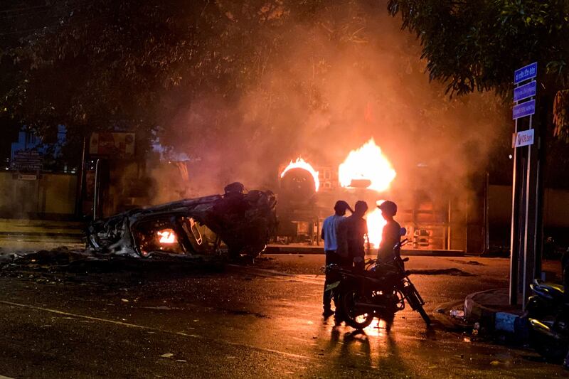 A bus burns close to Sri Lanka's outgoing Prime Minister Mahinda Rajapaksa's official residence in Colombo. AFP