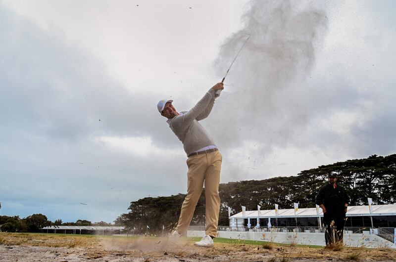 Adam Scott of Australia hits to the green during a practice round. AFP