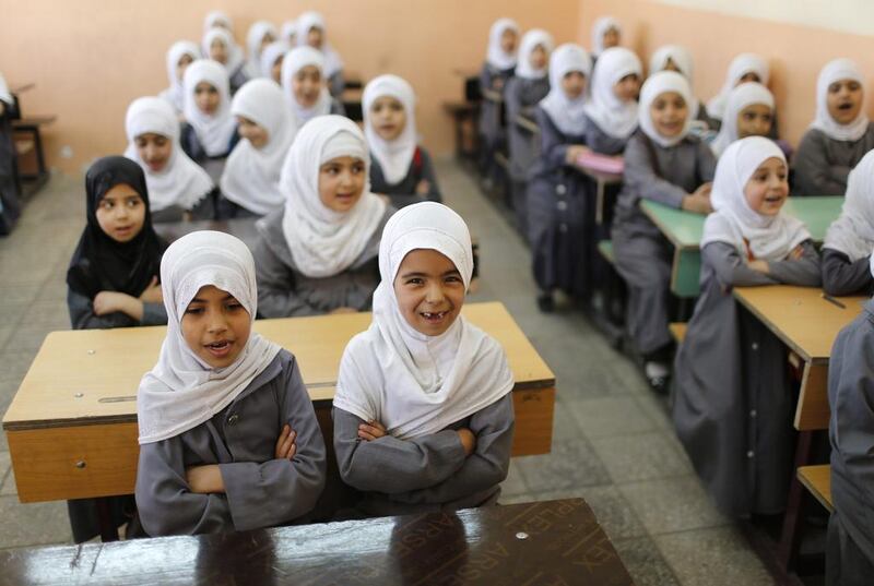 Iraqi Shi’ite girls attend classes at an Islamic school in Sadr City.