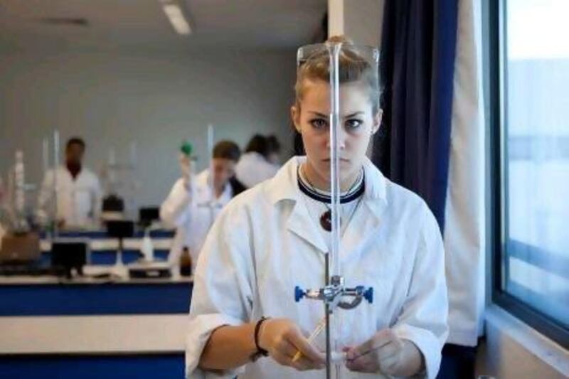 Chloe Muller, 17, a student at Lycee Louis Massignon, works on an experiment during the qualifying examination yesterday for a worldwide chemistry competition for French-language schools.