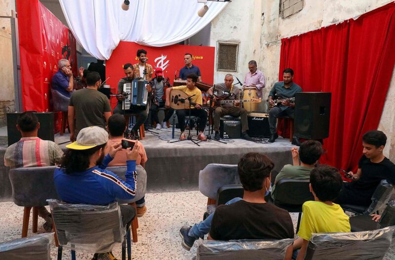 People attend a concert during a rare cultural event in the coastal city of Benghazi in eastern Libya. AFP