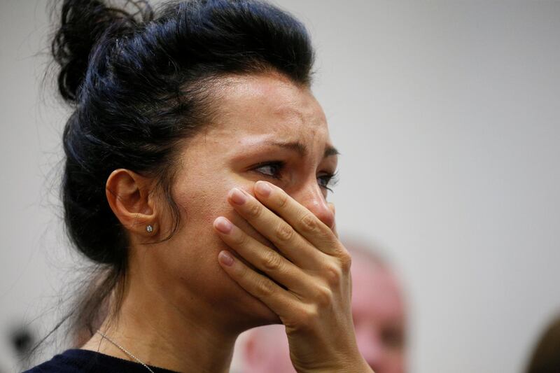 A woman reacts during a news briefing following the crash of the Boeing 737-800 plane, flight PS 752, on the outskirts of Tehran, at the Boryspil International Airport, outside Kiev, Ukraine January 8, 2020. REUTERS/Valentyn Ogirenko