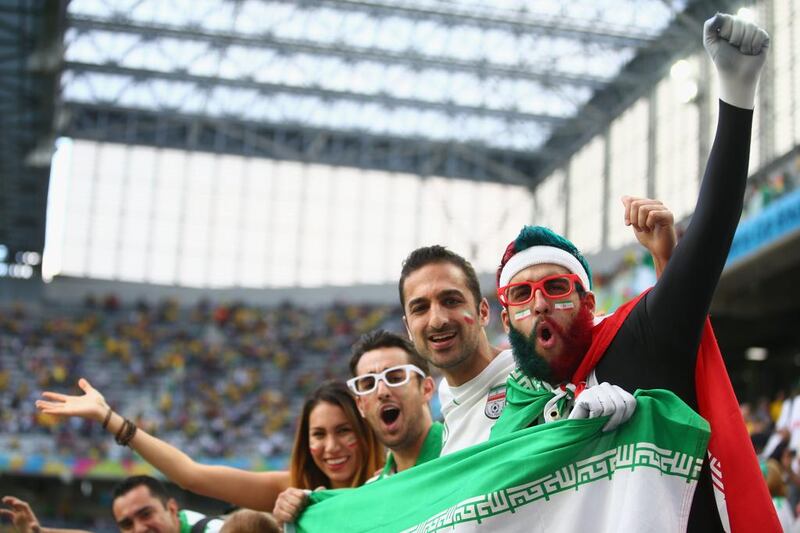 Iran fans cheer during their team's scoreless draw with Nigeria at the 2014 World Cup in Curitiba, Brazil on Monday. Julian Finney / Getty Images