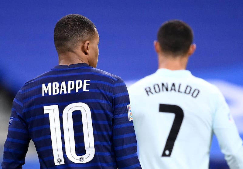 France's Kylian Mbappe alongside Cristiano Ronaldo, of Portugal, during the goalless Nations League match at the Stade de France in Paris on Sunday, October 11. AFP