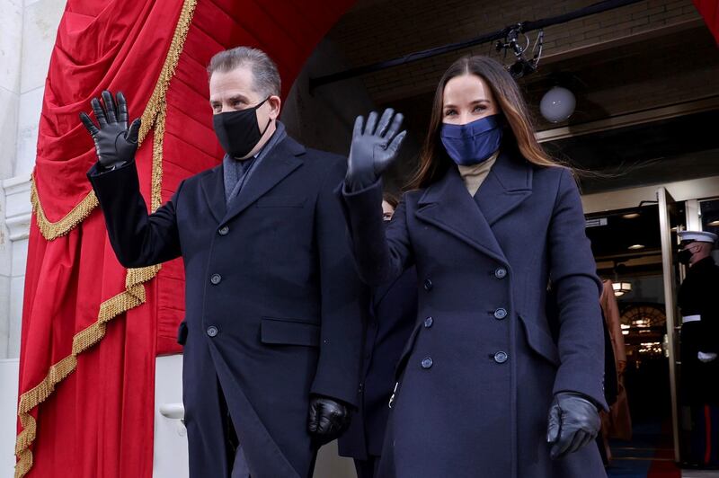 The son and daughter of President Joe Biden, Hunter and Ashley, wave as they arrive to attend his inauguration at the US Capitol. AP