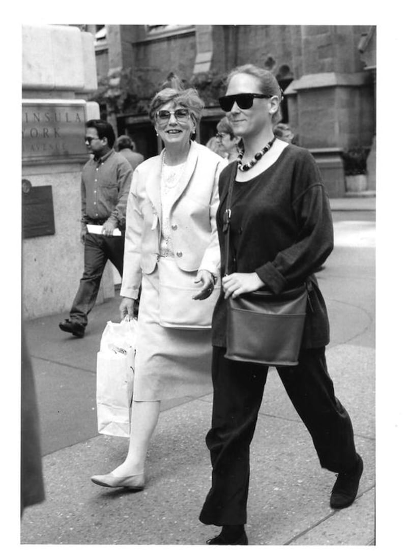The photo is of me (Liz Claus) and my mother (Dorothy Claus), walking down Fifth Avenue sometime in the late 1980s or early 90s. We had just had lunch at Henri Bendel - one of our favourite spots, when Bill Cunningham jumped out and snapped the pic. I was surprised, but Mom saw him right away. When I saw him in the office later, he clipped the negative (there was only one frame), and gave it to me. When I look at that photo now, I see how it's a quintessential Bill Cunningham photo. I was unaware at the time that we were dressed so similarly but in opposite colours; same bag, too! I'm sure Bill would have remembered exactly what year the photo was taken. Photo by Bill Cunningham