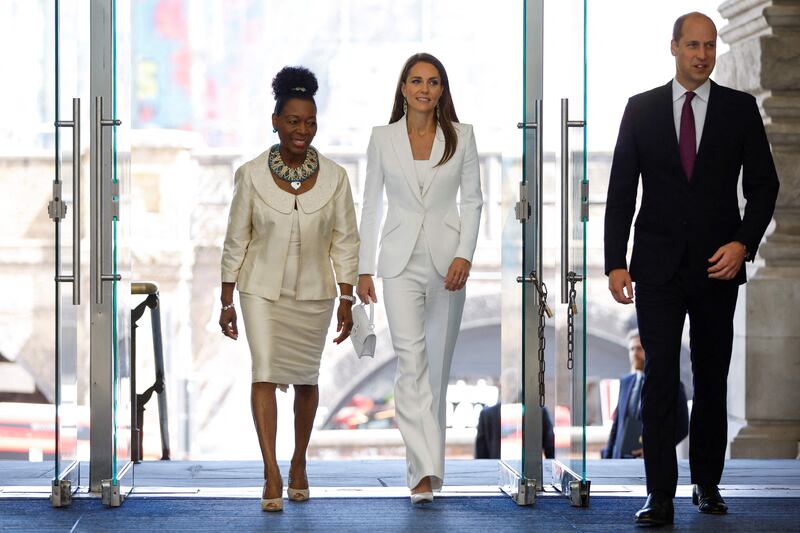 Prince William and Kate arrive, accompanied by Baroness Floella Benjamin. AFP