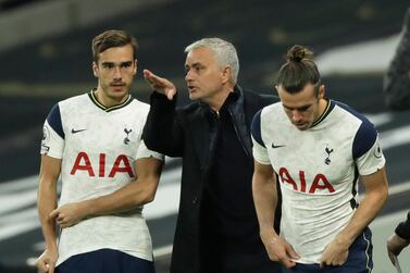 Soccer Football - Premier League - Tottenham Hotspur v West Ham United - Tottenham Hotspur Stadium, London, Britain - October 18, 2020 Tottenham Hotspur manager Jose Mourinho speaks with Gareth Bale and Harry Winks before they come on as substitutes Pool via REUTERS/Matt Dunham EDITORIAL USE ONLY. No use with unauthorized audio, video, data, fixture lists, club/league logos or 'live' services. Online in-match use limited to 75 images, no video emulation. No use in betting, games or single club /league/player publications. Please contact your account representative for further details.