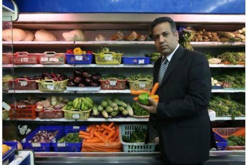 Yousrey Elsharkawi, a food business consultant. examines local produce at a supermarket in the Abu Hail area in Deira. Pawan Singh / The National