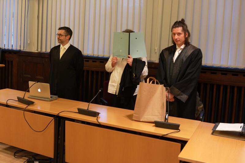 Nadine K stands between her lawyers in court in Koblenz, Germany. Reuters