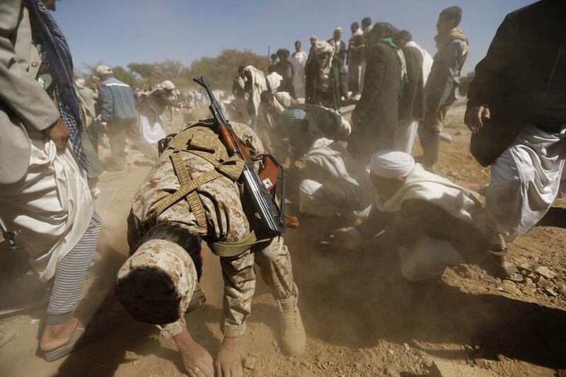 Members of the Shi'ite Muslim Houthi movement bury fellow Houthi fighters, gunned down by suspected al Qaeda militants recently, in Sanaa on December 29. Khaled Abdullah / Reuters