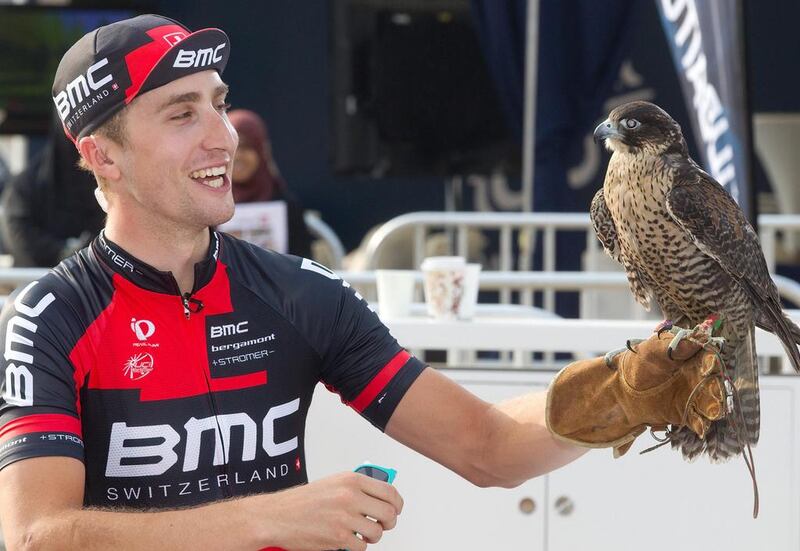 US rider Taylor Phinney of BMC Racing Team holds a raptor after winning the first stage of the Dubai Tour cycling race, a 9.9 km individual time trial, in Dubai on Wednesday. Angelo Carconi / EPA