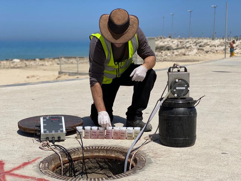 A Kando employee uses equipment to detect coronavirus in wastewater in Israel. Kando