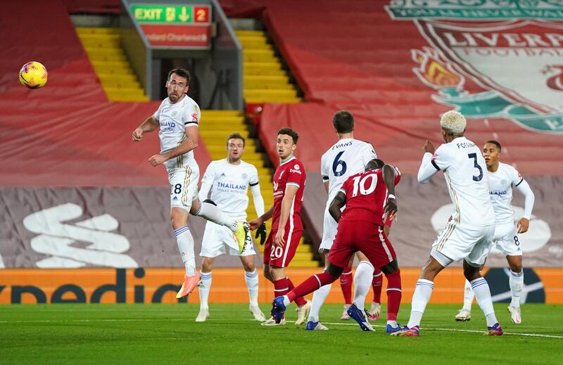 Jonny Evans of Leicester scores an own goal to give Liverpool the lead. Getty