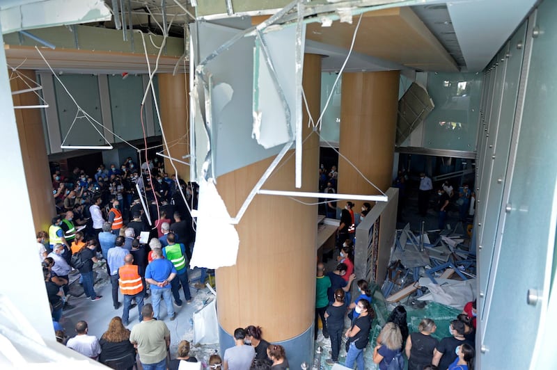 People and employees attend a mass over the victims who were killed in the blast, at the Al-Roum hospital at Ashrafieh area in Beirut.  EPA