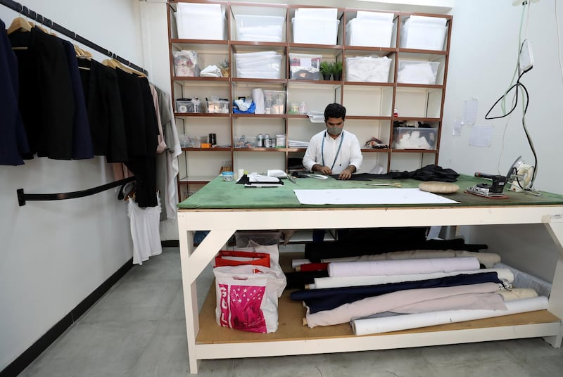 Dubai, United Arab Emirates - Reporter: N/A. Standalone. Covid-19/Coronavirus. Tailor Zeeshan Javed makes a pair of trousers with Coivd protection measures in place. Thursday, August 27th, 2020. Dubai. Chris Whiteoak / The National