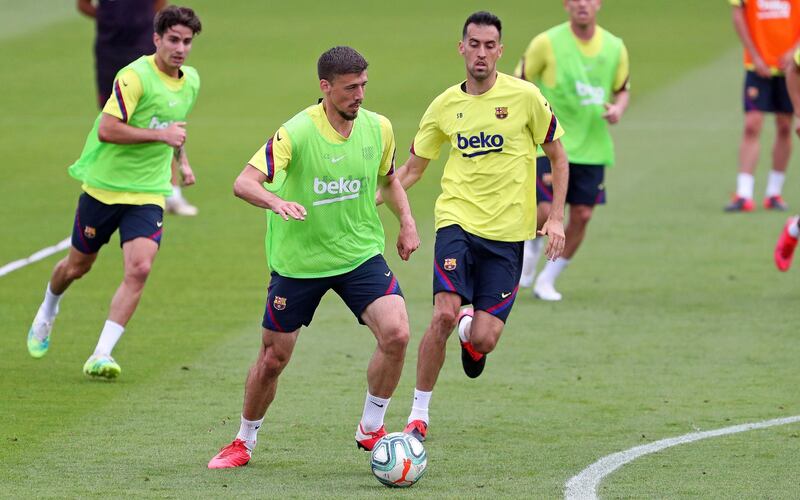 Barcelona players Clement Lenglet and Sergio Busquets during a training session at Joan Gamper sports city. EPA