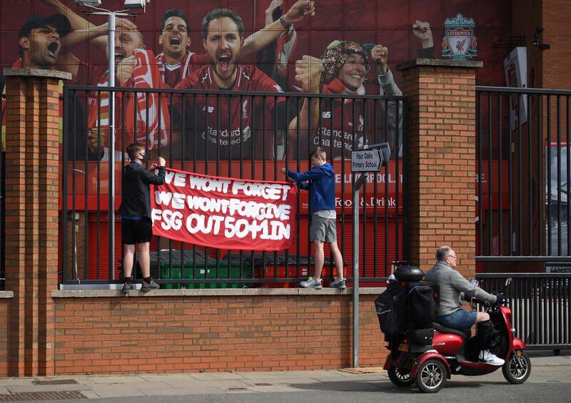 Supporters protest against Liverpool's US owner John W. Henry and the Fenway Sports Group (FSG) outside Liverpool's Anfield Stadium. AFP