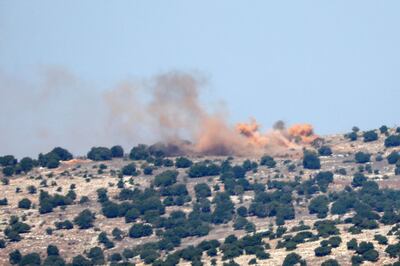Smoke rises from hills above the souther Lebanese village of Maroun Al Ras, opposite the Israeli Moshav of Avivim during Israeli artillery shelling on October 25, 2023. AFP