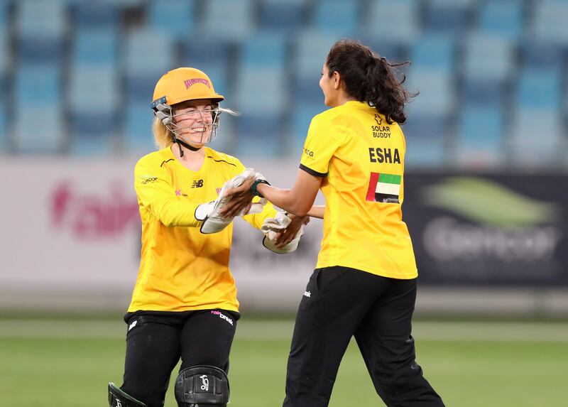 Warriors' Esha Oza takes the wicket of Falcons' Suzie Bates.