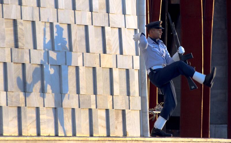 A Pakistani Air Force cadet performs during a guard mounting ceremony for the father and founder of the nation, Quaid-e-Azam Mohammad Ali Jinnah, to mark his birthday, in the southern port city of Karachi, Pakistan. The ceremony, held by Pakistan Military Academy cadets, is an annual feature that pays homage to the father of the nation.  Rehan Kahn / EPA.