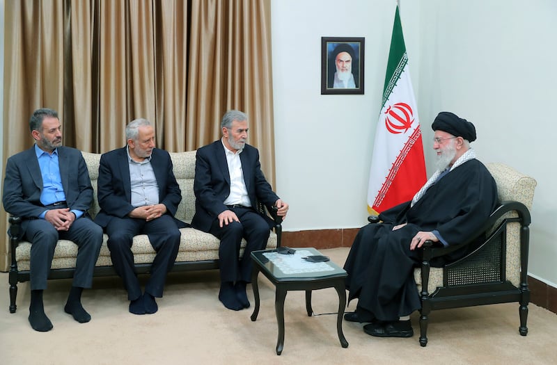 Iran's supreme leader Ayatollah Ali Khamenei, right, with Palestinian Islamic Jihad leader Ziad Al Nakhaleh, second right, in Tehran. AP