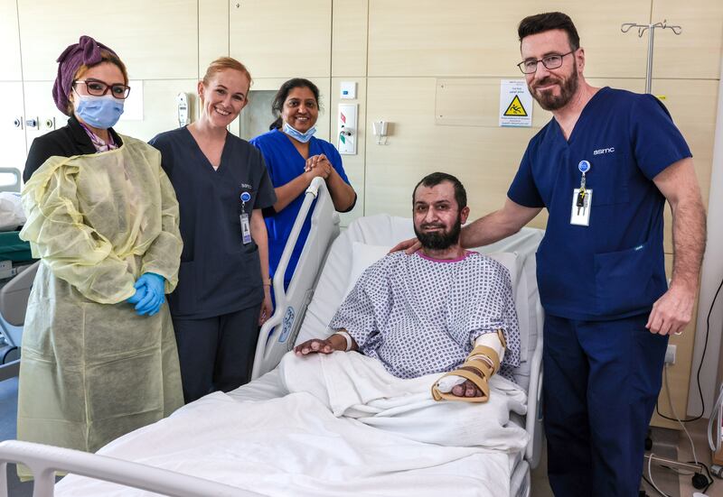Patient Nawab Shahnawaz with Sheikh Shakhbout Medical City staff members, from left to right, Ranya Shehab, Zaskia Ezendam, Biji Varghese and Dr Simon Myers. All photographs: Victor Besa / The National