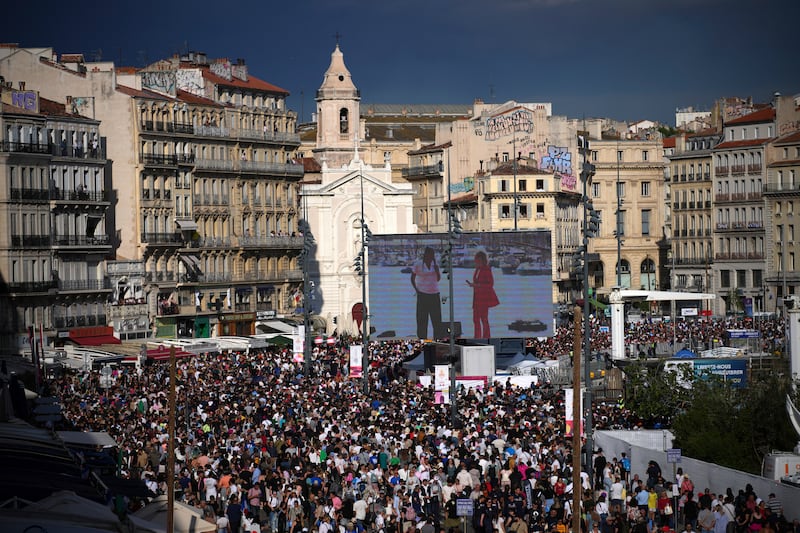 Crowds watch the welcoming ceremony for the Belem and the Olympic Flame in Marseille. AP