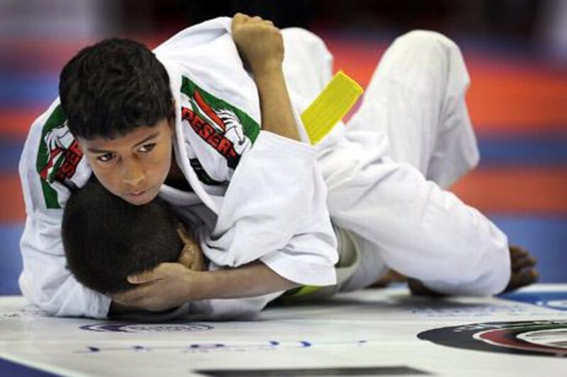 ABU DHABI, UNITED ARAB EMIRATES -   April 12, 2012 -  Jiu-Jitsu action from the World Kids Championship, which kicked off the start of the World Professional Jiu-Jitsu Championship in Abu Dhabi on Thursday, April 12, 2012 at ADNEC.    ( DELORES JOHNSON / The National )