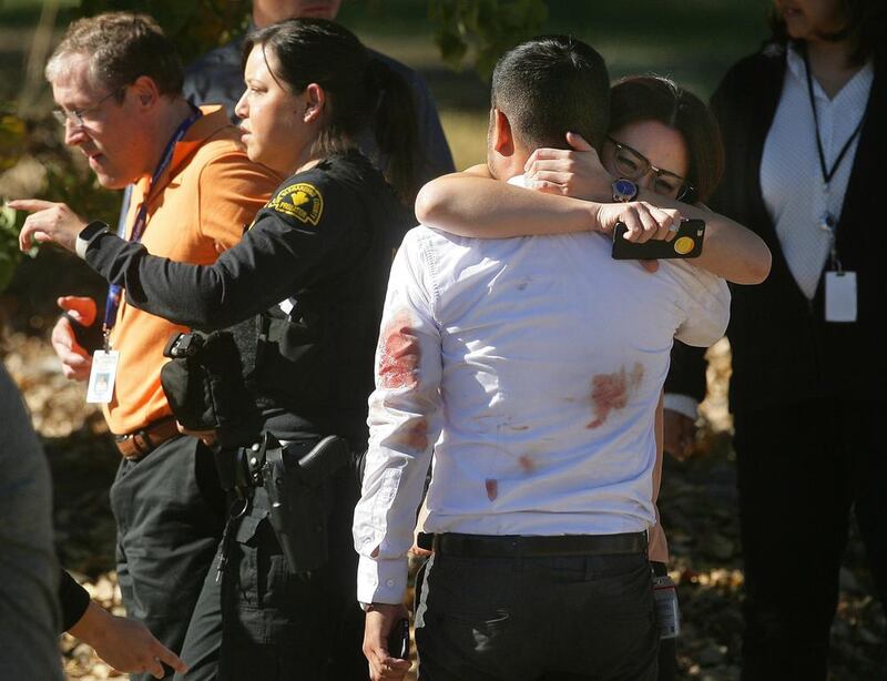 A couple embraces following the mass shooting that killed 14 people in San Bernardino, California on December 2. David Bauman/The Press-Enterprise via AP