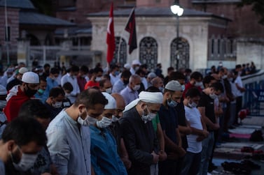 People gather for evening prayers outside Istanbul’s famous Hagia Sophia on July 10, 2020 in Istanbul, Turkey. Getty