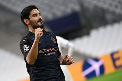 Manchester City's German midfielder Ilkay Gundogan celebrates after scoring a goal during the UEFA Champions League Group C football match between Olympique de Marseille and Manchester City on October 27, 2020 at the Velodrome Stadium in Marseille. / AFP / CHRISTOPHE SIMON
