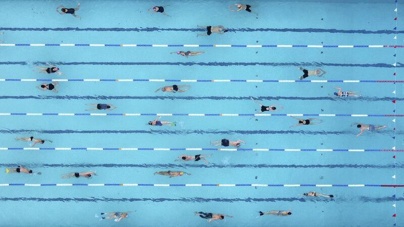 Swimmers train in Hampton Lido on the first day that outdoor pools are open following the easing of lockdown restrictions, amid the spread of the coronavirus disease (COVID-19) pandemic in London, Britain, March 29, 2021. Picture taken with a drone. REUTERS/Toby Melville
