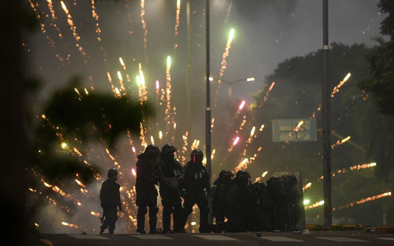 Riot police confront supporters of Luis Fernando Camacho, a key opposition figure, following his arrest in Santa Cruz, Bolivia.  AFP