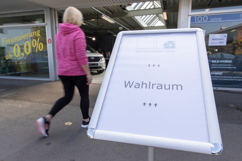 A sign for a polling station at a car dealership in Lemgo, Germany. AP