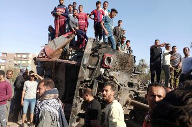 Mangled train carriages at the scene of the accident in the southern Egyptian city of Sohag. AP