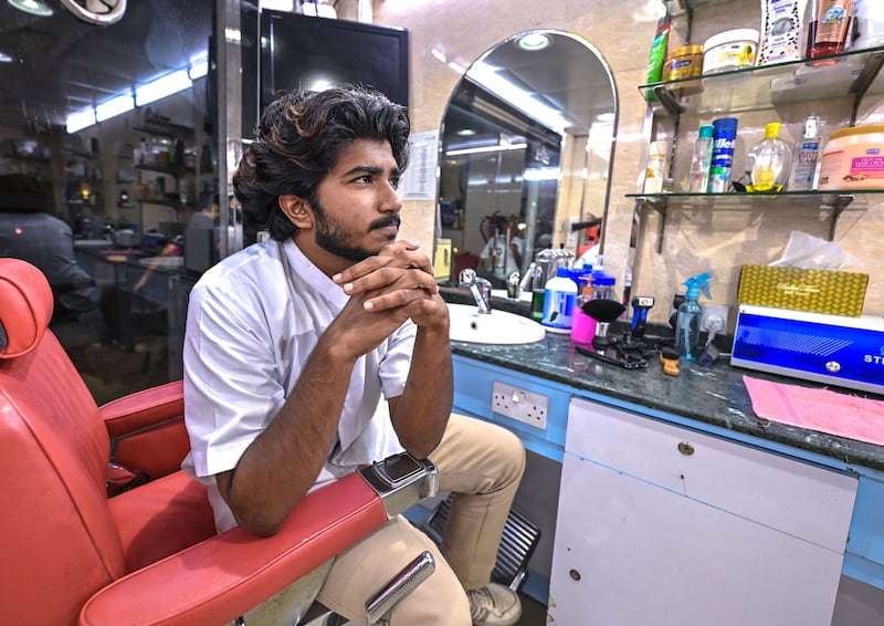 Shibil Mohammad, 21, from Kerala, is the youngest barber at Al Amar Salon to have his own chair