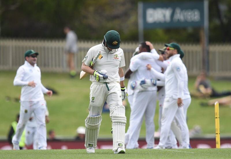 Australian captain Steve Smith departs after being dismissed by South African bowler Kagiso Rabada.  Dave Hunt / EPA