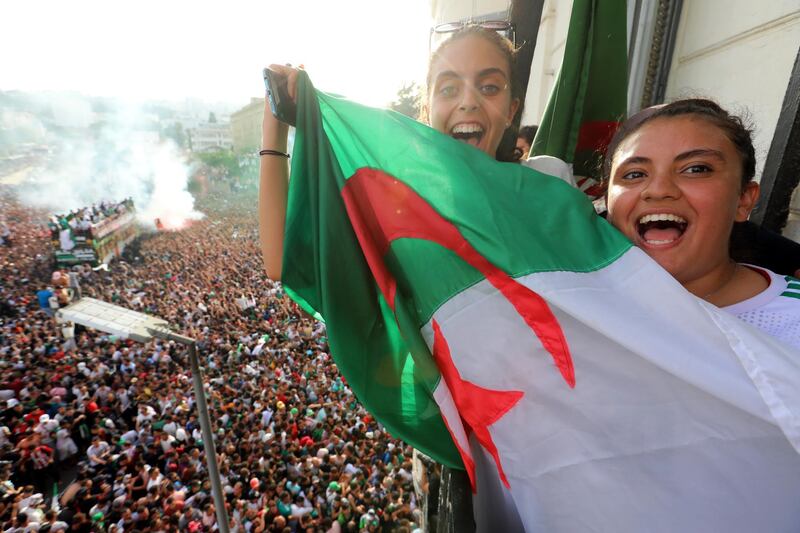 Two very happy Algeria fans. EPA