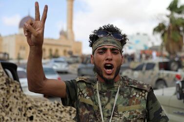 A fighter loyal to the GNA celebrates after regaining control over Tarhouna city. Reuters