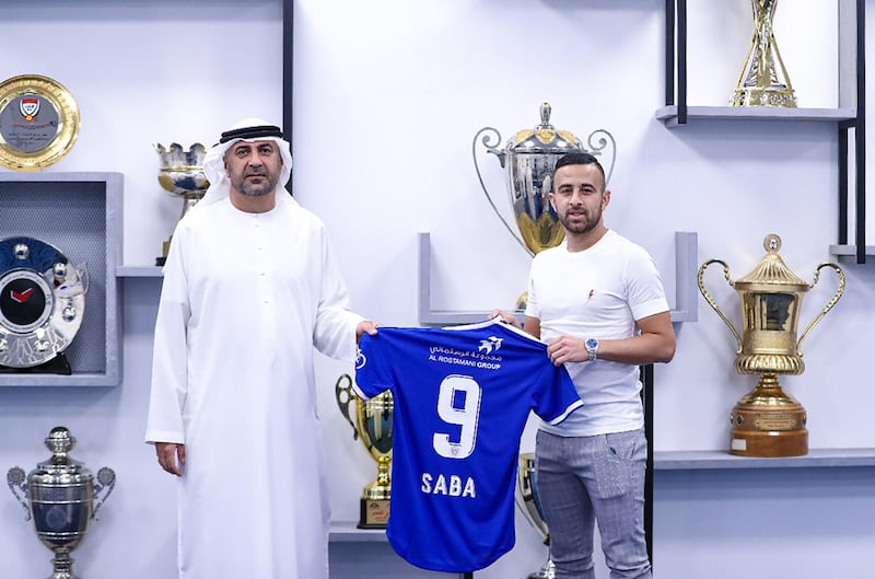 A handout picture provided by the Emirati club Al-Nasr SC on September 27, 2020, shows Israeli midfielder Dia Saba (R) posing with a club official during his official presentation at the club. === RESTRICTED TO EDITORIAL USE - MANDATORY CREDIT "AFP PHOTO / HO / AL-NASR SC" - NO MARKETING NO ADVERTISING CAMPAIGNS - DISTRIBUTED AS A SERVICE TO CLIENTS ===
 / AFP / Al-Nasr SC / - / === RESTRICTED TO EDITORIAL USE - MANDATORY CREDIT "AFP PHOTO / HO / AL-NASR SC" - NO MARKETING NO ADVERTISING CAMPAIGNS - DISTRIBUTED AS A SERVICE TO CLIENTS ===
